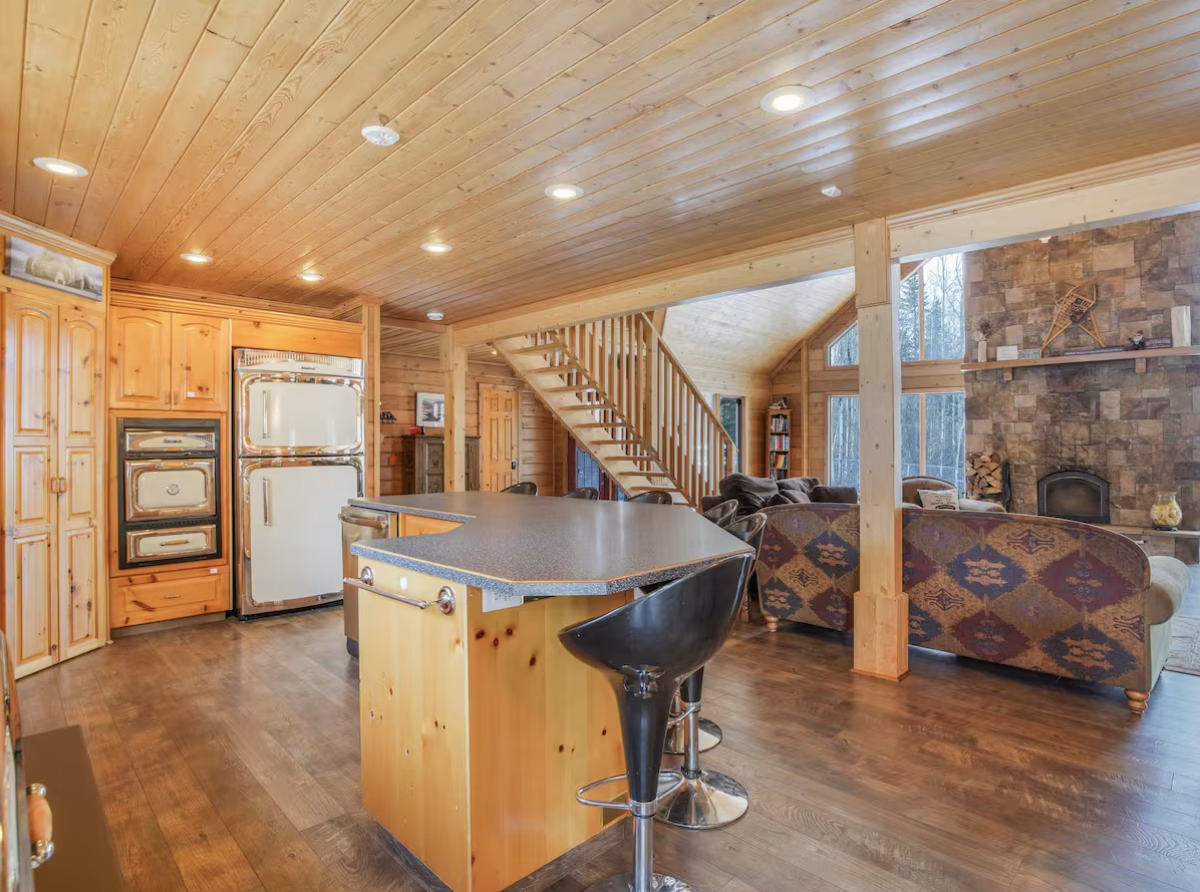 Kitchen and island seating in the Lessard Lake log home